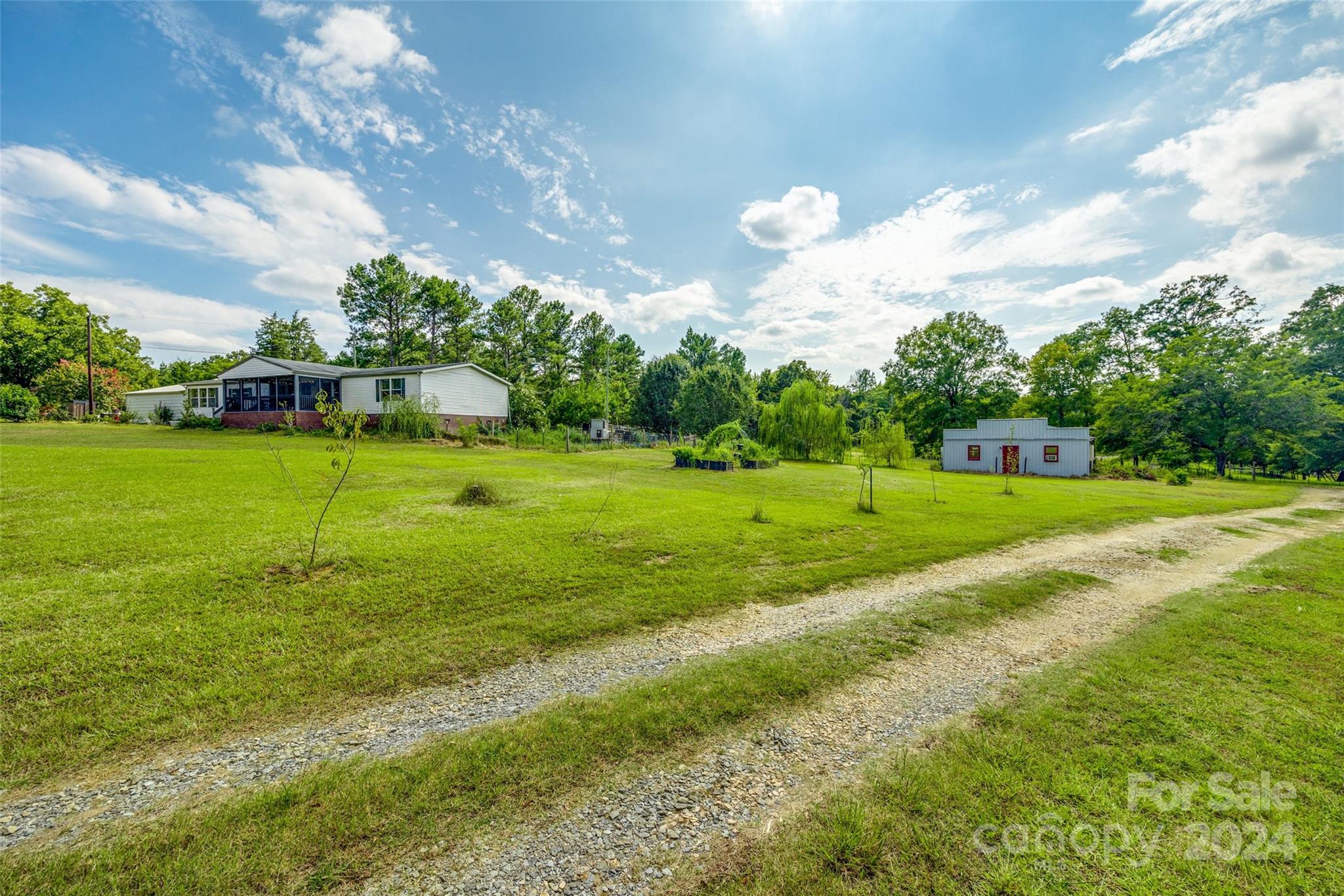1574 Dunlap Roddey Road Rock Hill, SC 29730 - Photo 1 of 35 a view of a golf course with a big yard