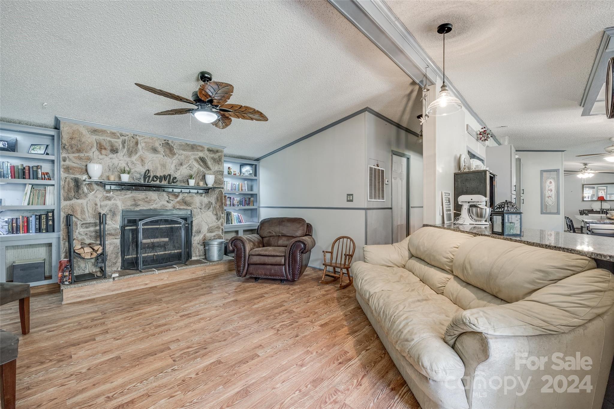 1574 Dunlap Roddey Road Rock Hill, SC 29730 - Photo 17 of 35 a living room with furniture a fireplace and a chandelier