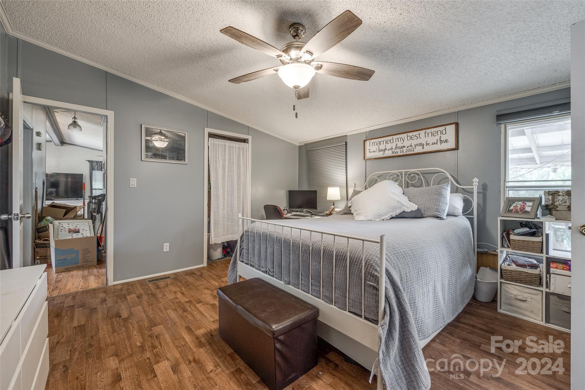 1574 Dunlap Roddey Road Rock Hill, SC 29730 - Photo 23 of 35 a bedroom with a bed and a chandelier