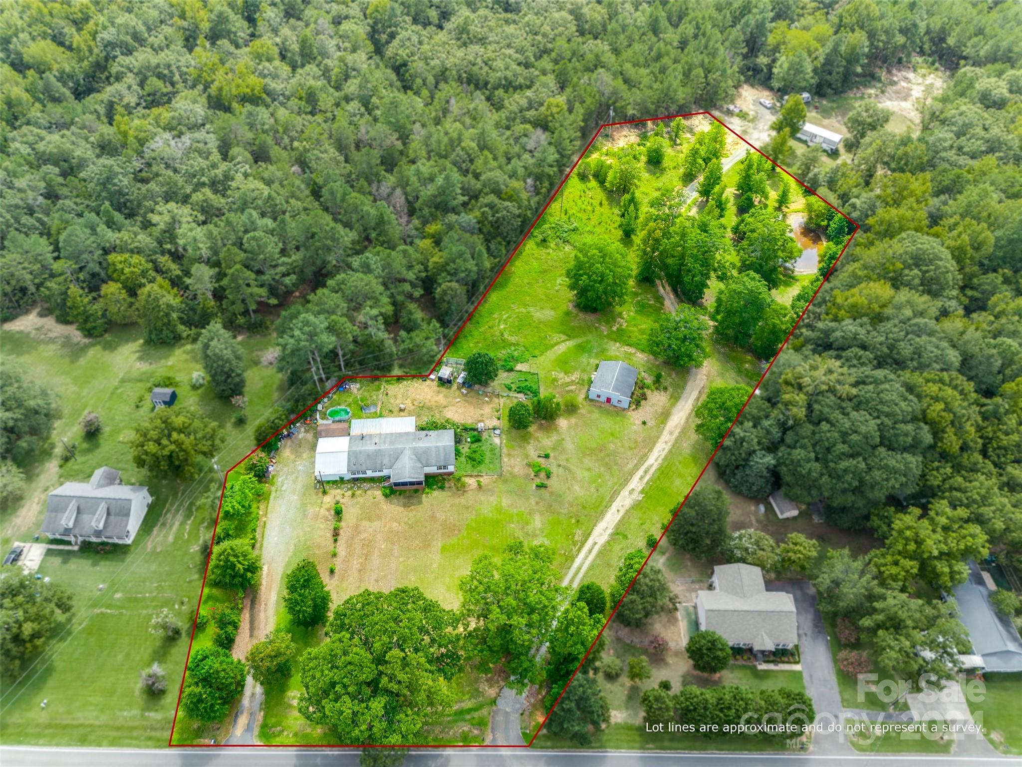 1574 Dunlap Roddey Road Rock Hill, SC 29730 - Photo 3 of 35 an aerial view of residential house with outdoor space and trees all around