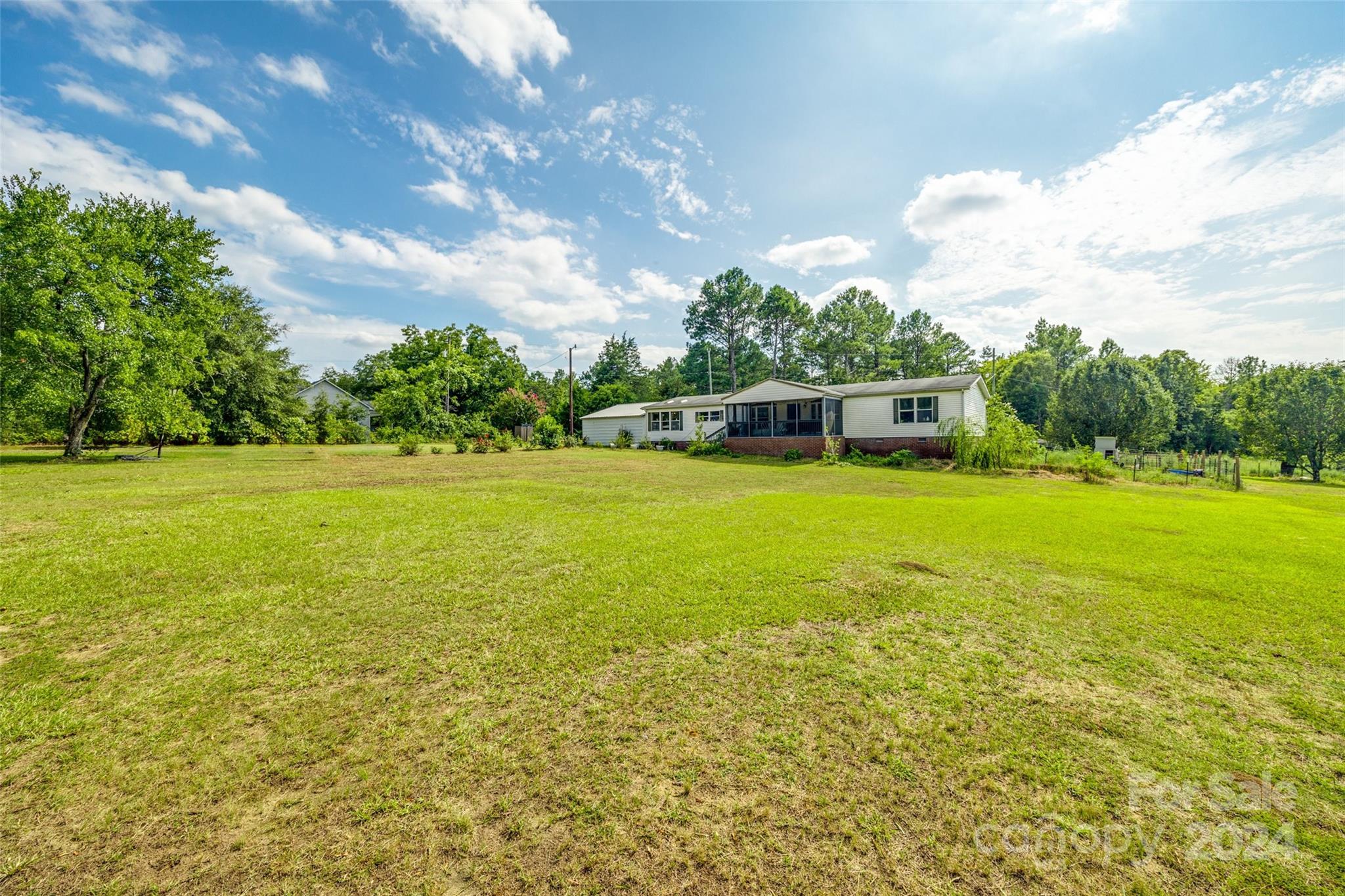 1574 Dunlap Roddey Road Rock Hill, SC 29730 - Photo 32 of 35 a view of a lake and a yard