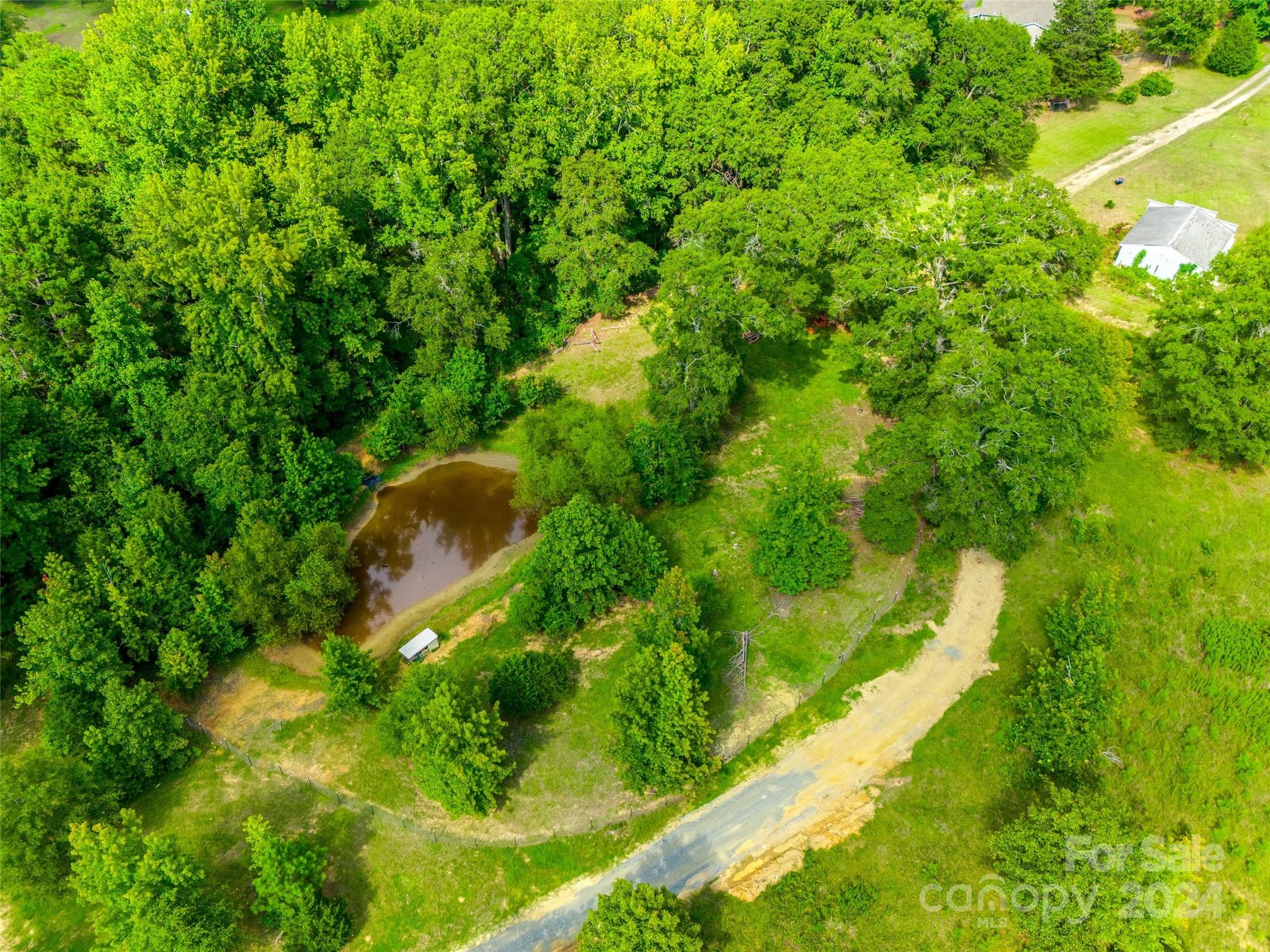 1574 Dunlap Roddey Road Rock Hill, SC 29730 - Photo 5 of 35 a backyard of a house with lots of green space