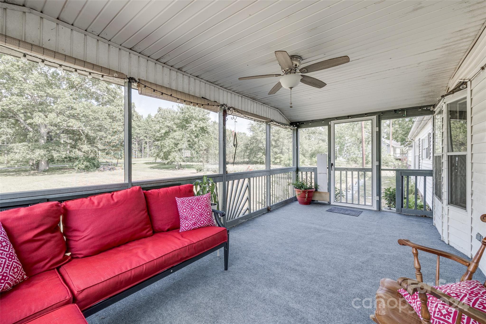 1574 Dunlap Roddey Road Rock Hill, SC 29730 - Photo 8 of 35 a living room with furniture a ceiling fan and a large window