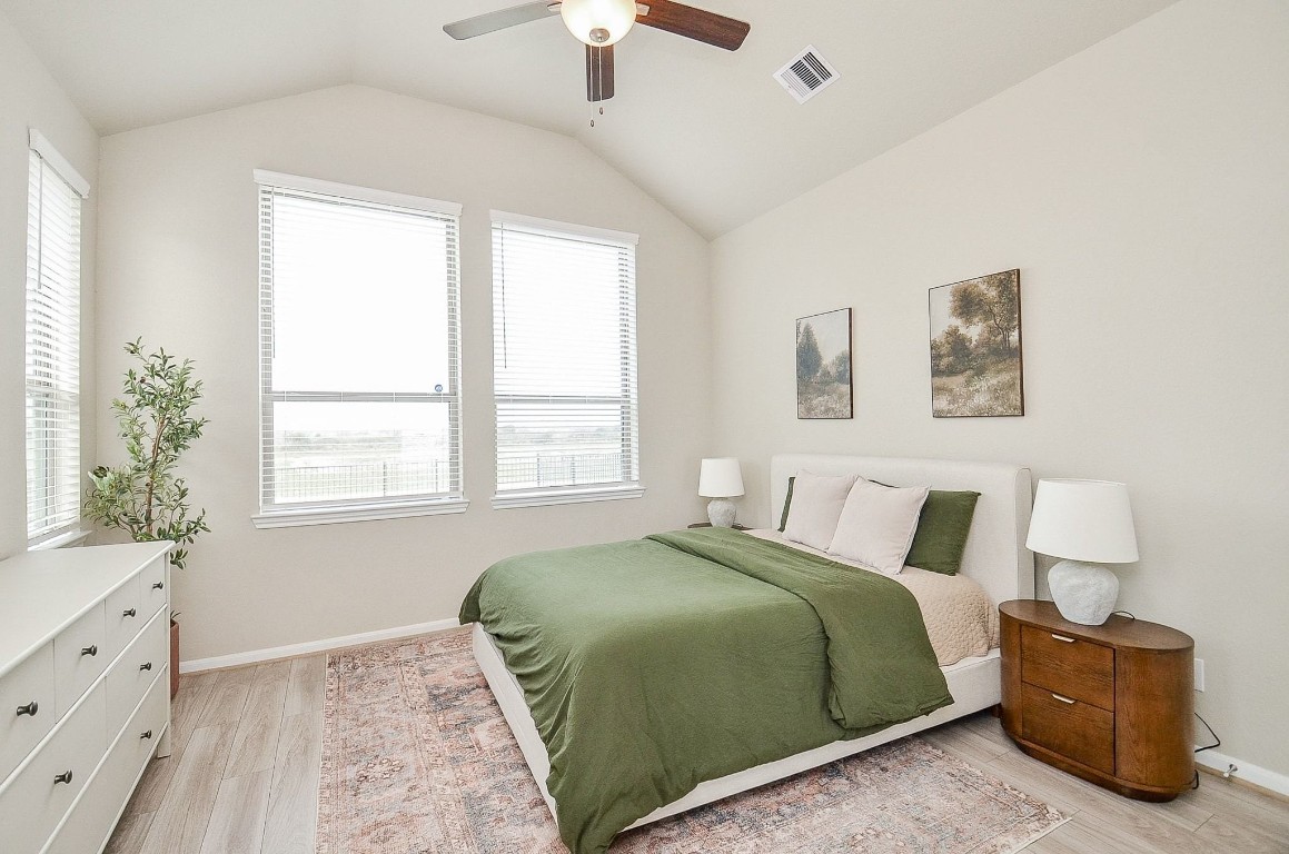 5146 Prairie Terrace Lane Fulshear, TX 77441 - Photo 3 of 31 a bedroom with a bed and a window