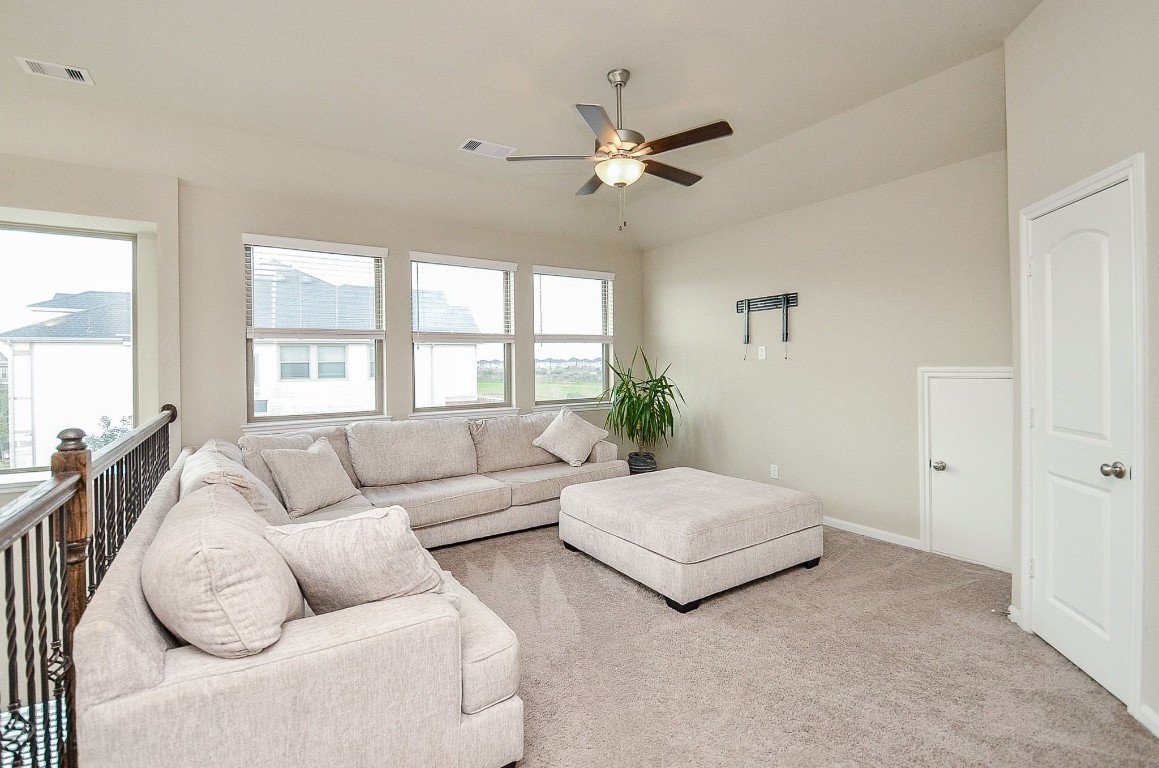 5146 Prairie Terrace Lane Fulshear, TX 77441 - Photo 5 of 31 a living room with furniture and a large window