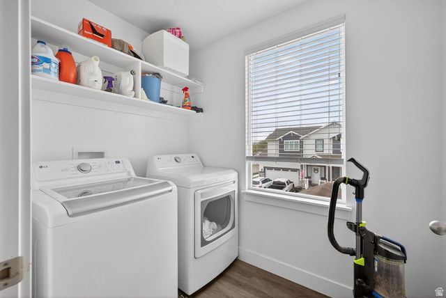 412 McClellan Court Provo, UT 84601 - Photo 20 of 20 Laundry room featuring dark wood-style floors and washer and dryer
