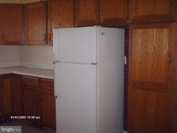 12 Commerce Street Taneytown, MD 21787 - Photo 12 of 21 a white refrigerator freezer sitting inside of a kitchen