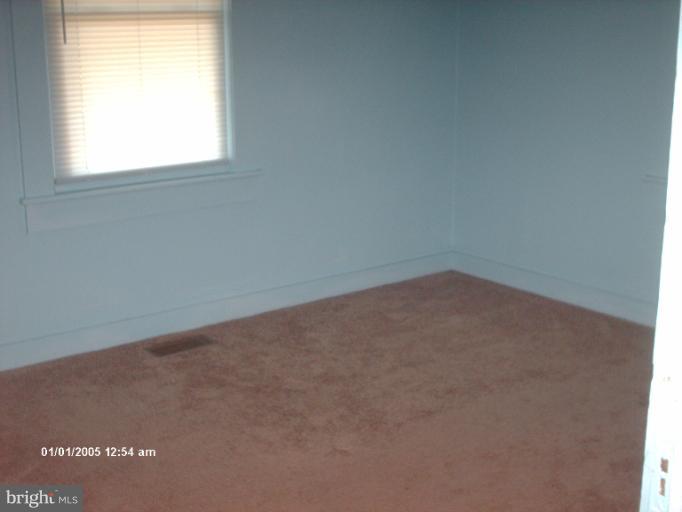12 Commerce Street Taneytown, MD 21787 - Photo 3 of 21 an empty room with a window