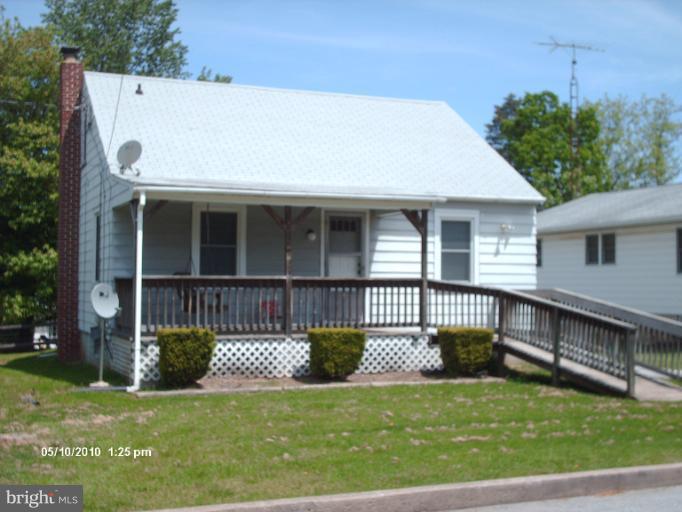 12 Commerce Street Taneytown, MD 21787 - Photo 4 of 21 a view of a house with a wooden deck and a yard
