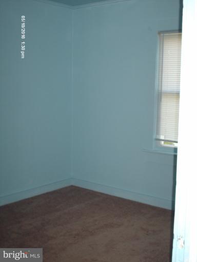 12 Commerce Street Taneytown, MD 21787 - Photo 5 of 21 an empty room with a window