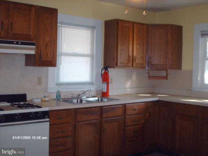 12 Commerce Street Taneytown, MD 21787 - Photo 6 of 21 a kitchen with sink cabinets and window