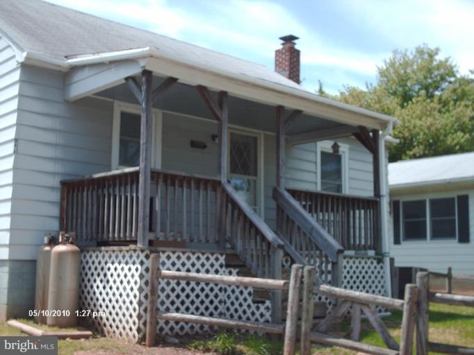 12 Commerce Street Taneytown, MD 21787 - Photo 8 of 21 a view of a house with wooden deck and furniture