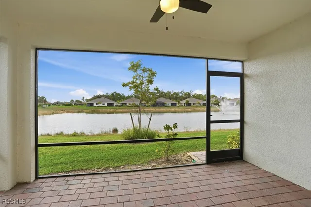 a view of a room with a big yard