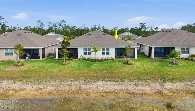 a aerial view of a house with a yard