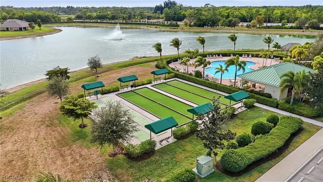 an aerial view of a house with outdoor space and lake view