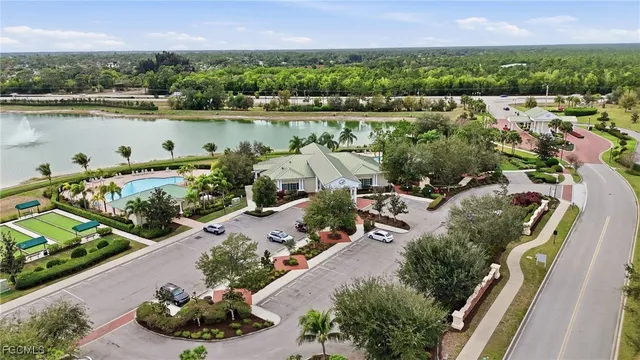 an aerial view of a house with a lake view