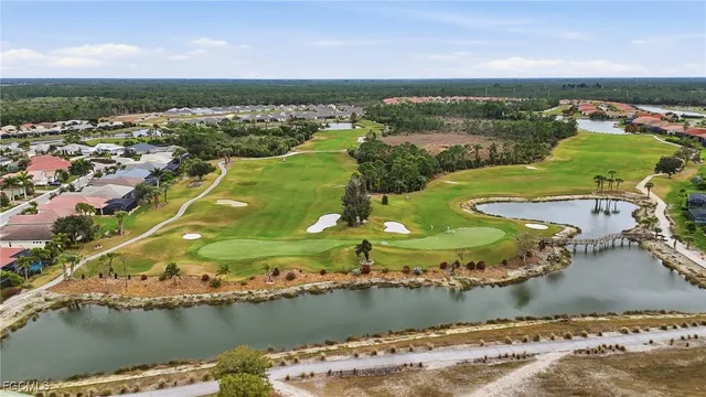 an aerial view of a house with a lake view