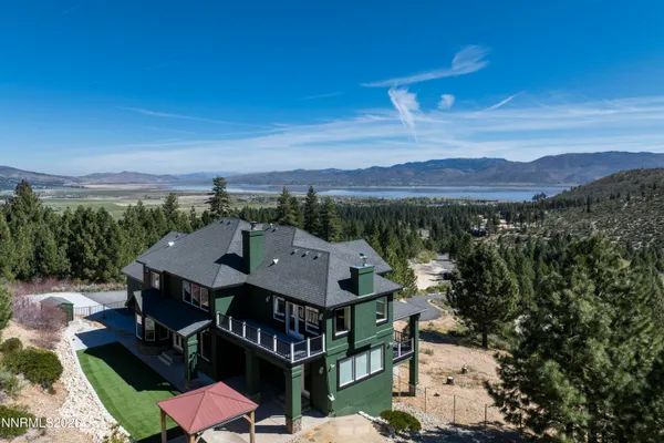 an aerial view of a house with a mountain view