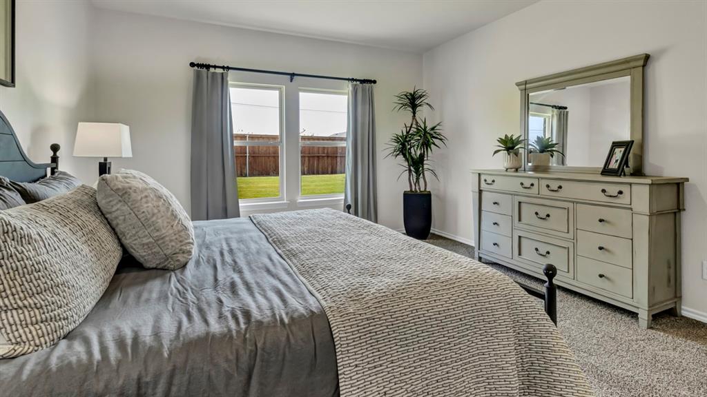 124 Pheasant Run Road Terrell, TX 75160 - Photo 30 of 35 Bedroom featuring neutral wall colors and carpeted flooring