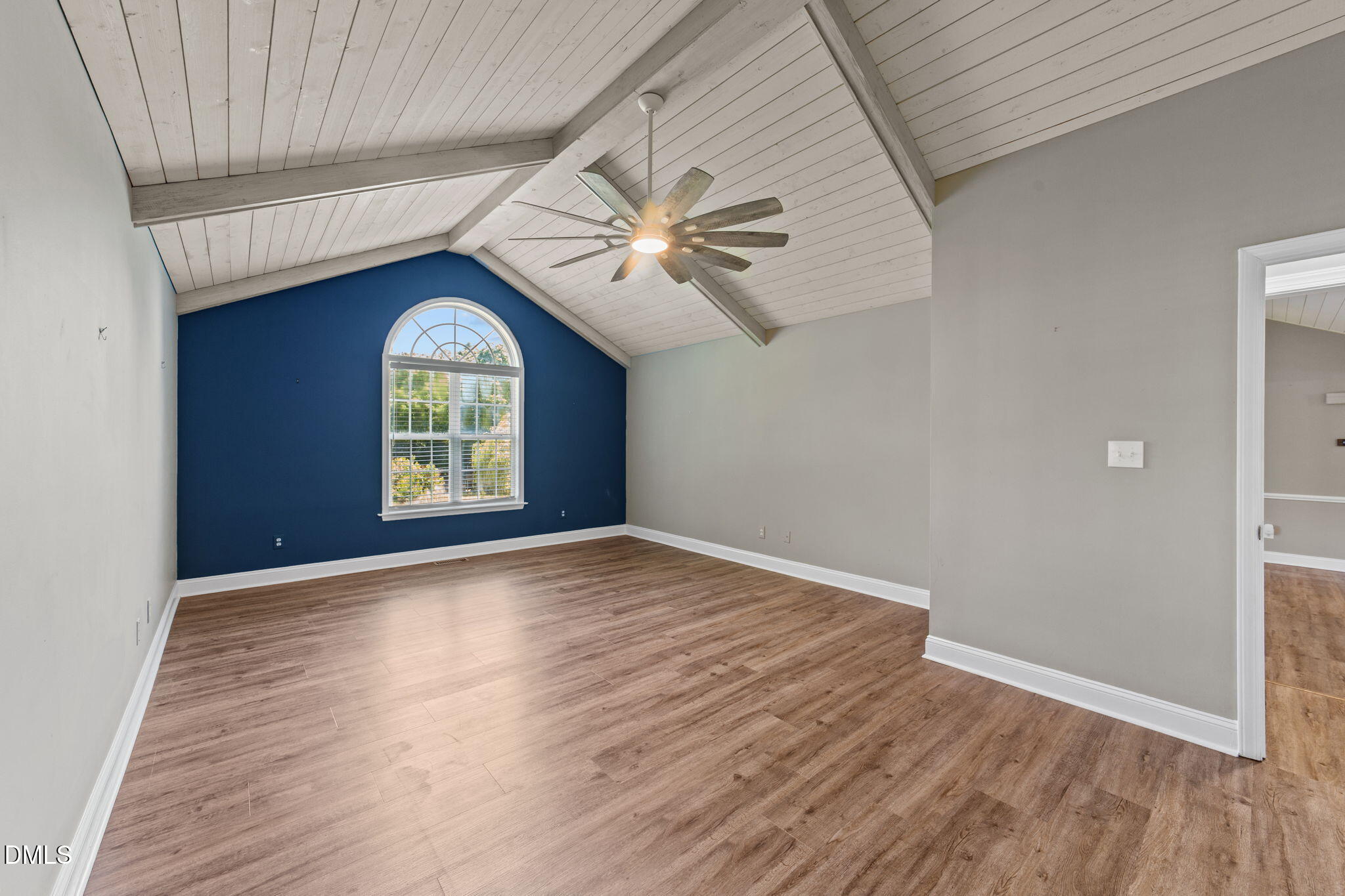6820 Oviedo Drive Raleigh, NC 27603 - Photo 23 of 50 an empty room with windows and fan