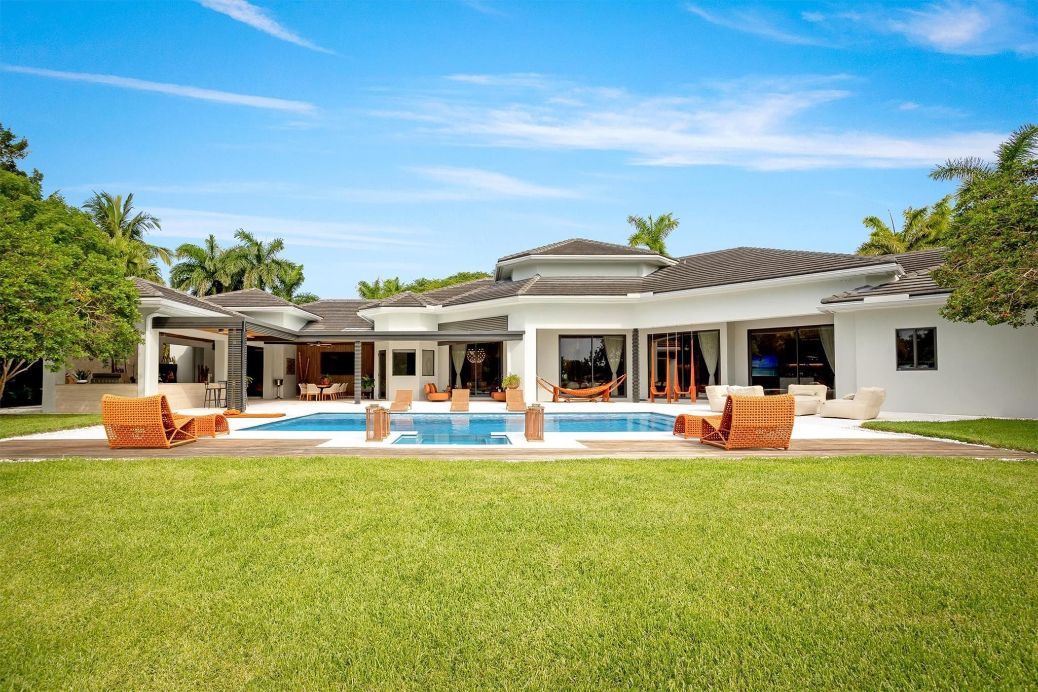 3340 Paddock Road Weston, FL 33331 - Photo 30 of 68 a front view of house with yard barbeque and outdoor seating
