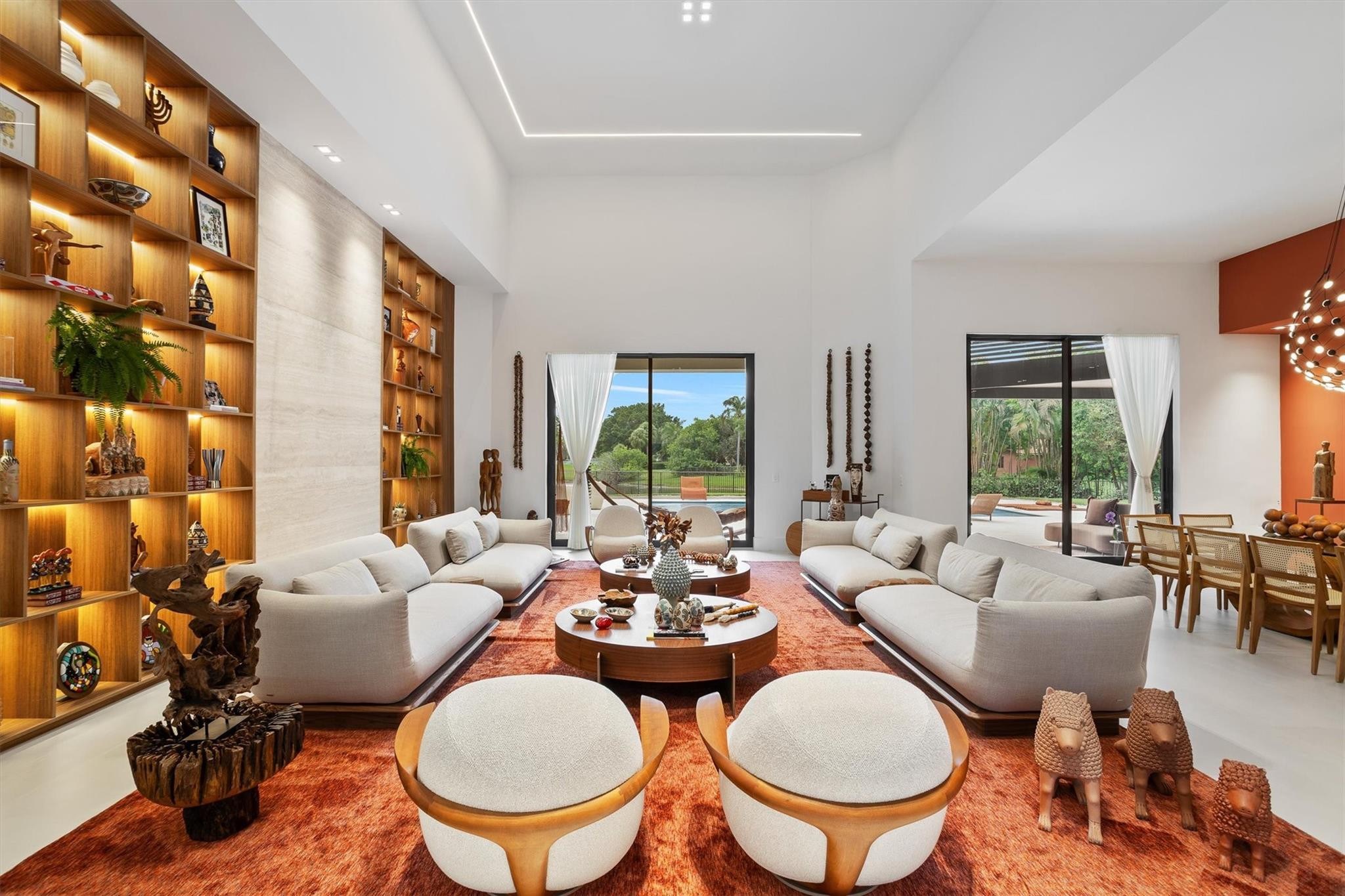 3340 Paddock Road Weston, FL 33331 - Photo 3 of 68 a living room with furniture a lamp and a large window