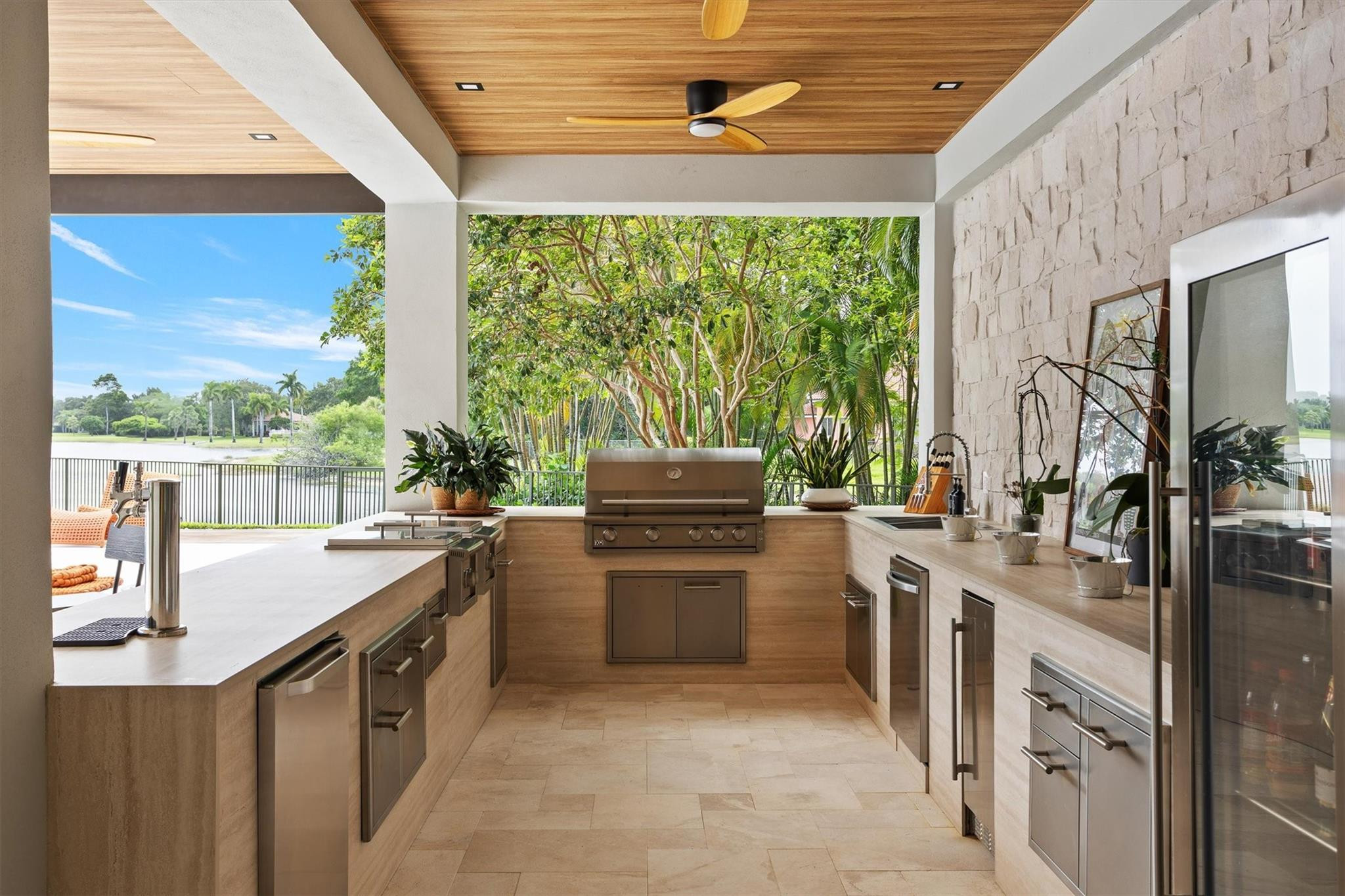 3340 Paddock Road Weston, FL 33331 - Photo 35 of 68 a kitchen with a sink stove and cabinets