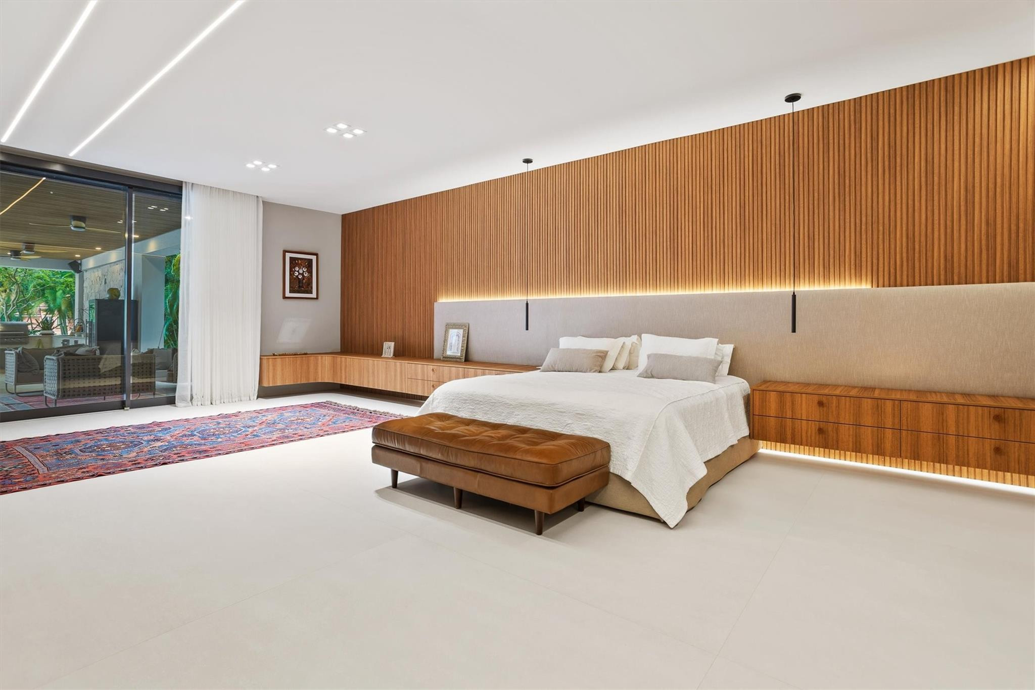 3340 Paddock Road Weston, FL 33331 - Photo 41 of 68 a spacious bedroom with a bed and a dresser