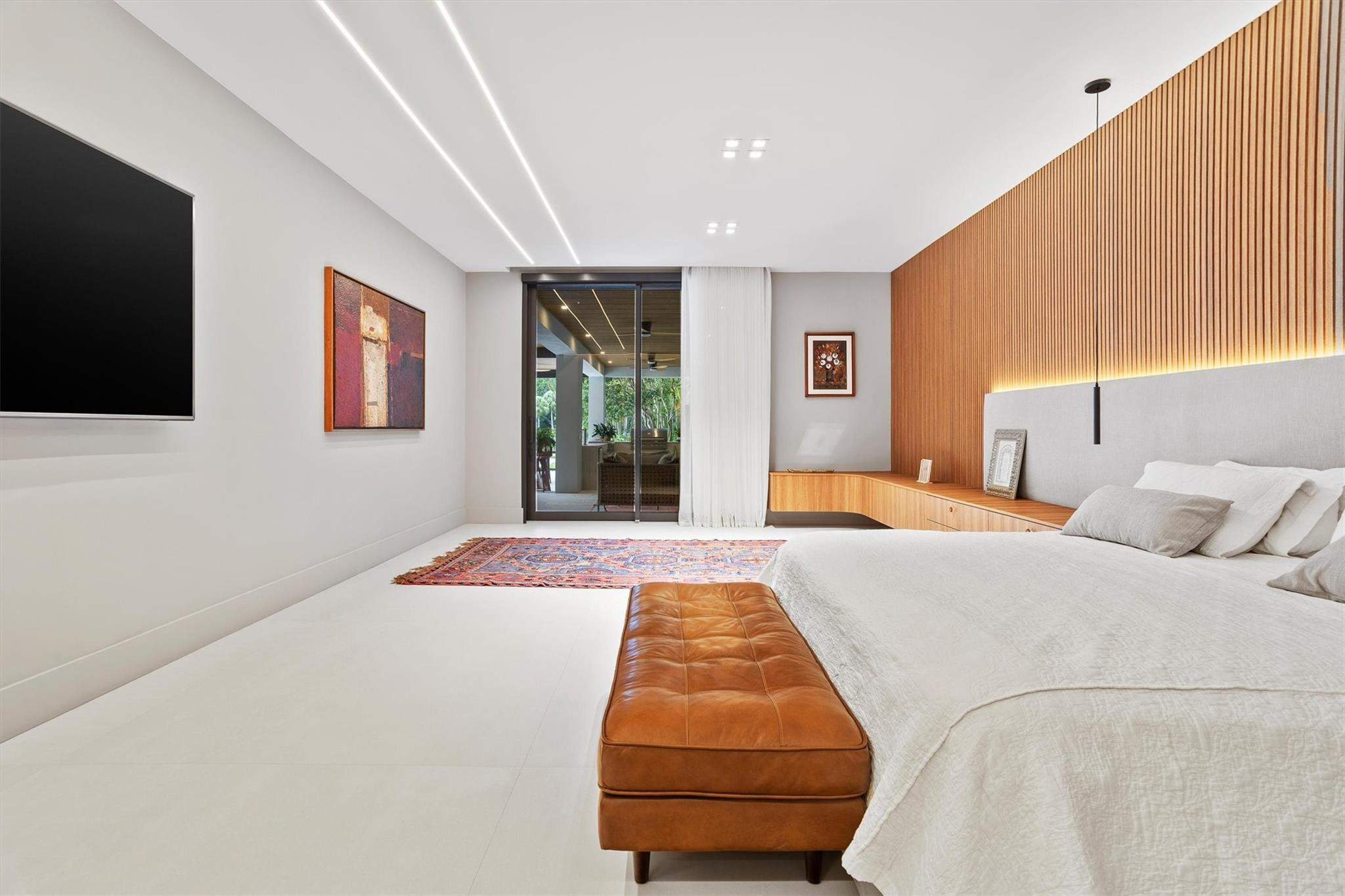 3340 Paddock Road Weston, FL 33331 - Photo 42 of 68 a bedroom with a bed and a flat screen tv