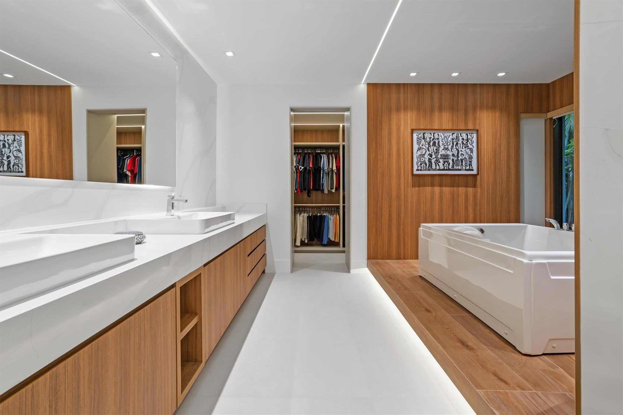 3340 Paddock Road Weston, FL 33331 - Photo 45 of 68 a spacious bathroom with a double vanity sink and a large mirror