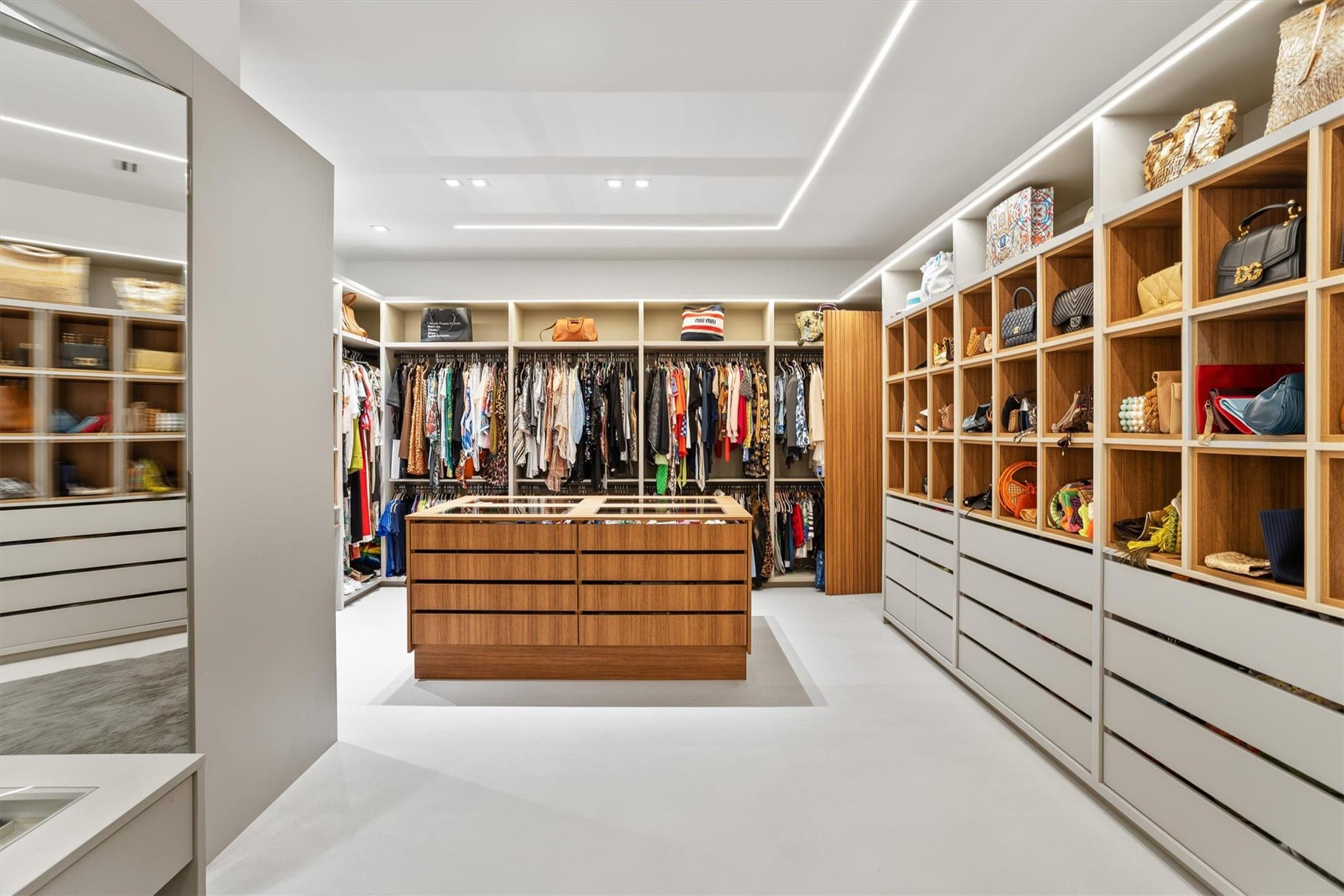 3340 Paddock Road Weston, FL 33331 - Photo 48 of 68 a view of walk in closet with clothes and shoes