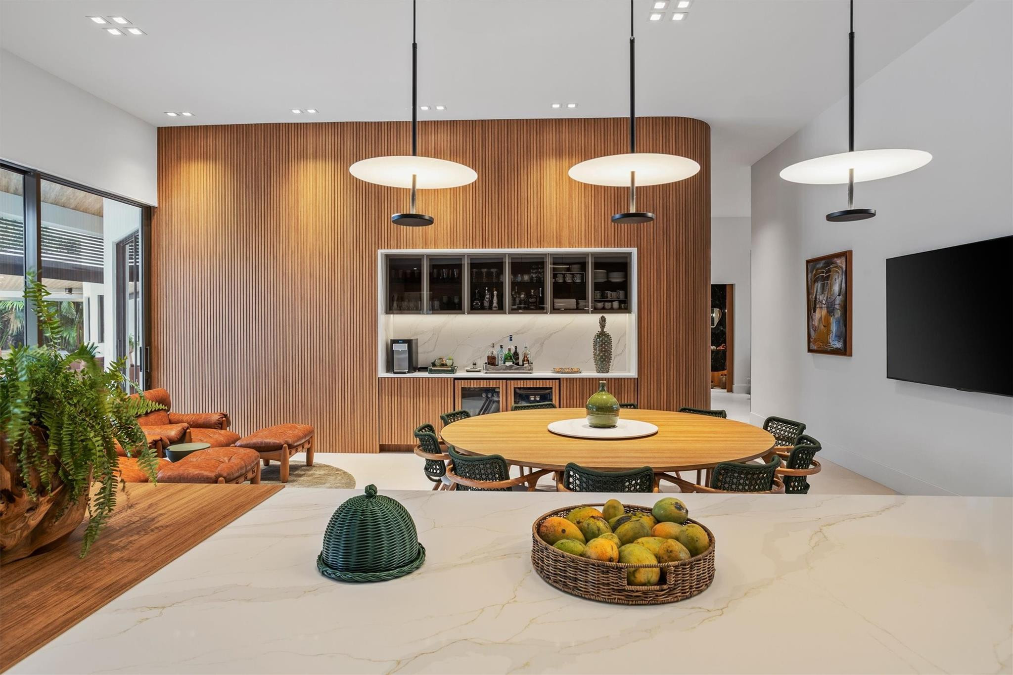 3340 Paddock Road Weston, FL 33331 - Photo 5 of 68 a room with table chairs and a chandelier