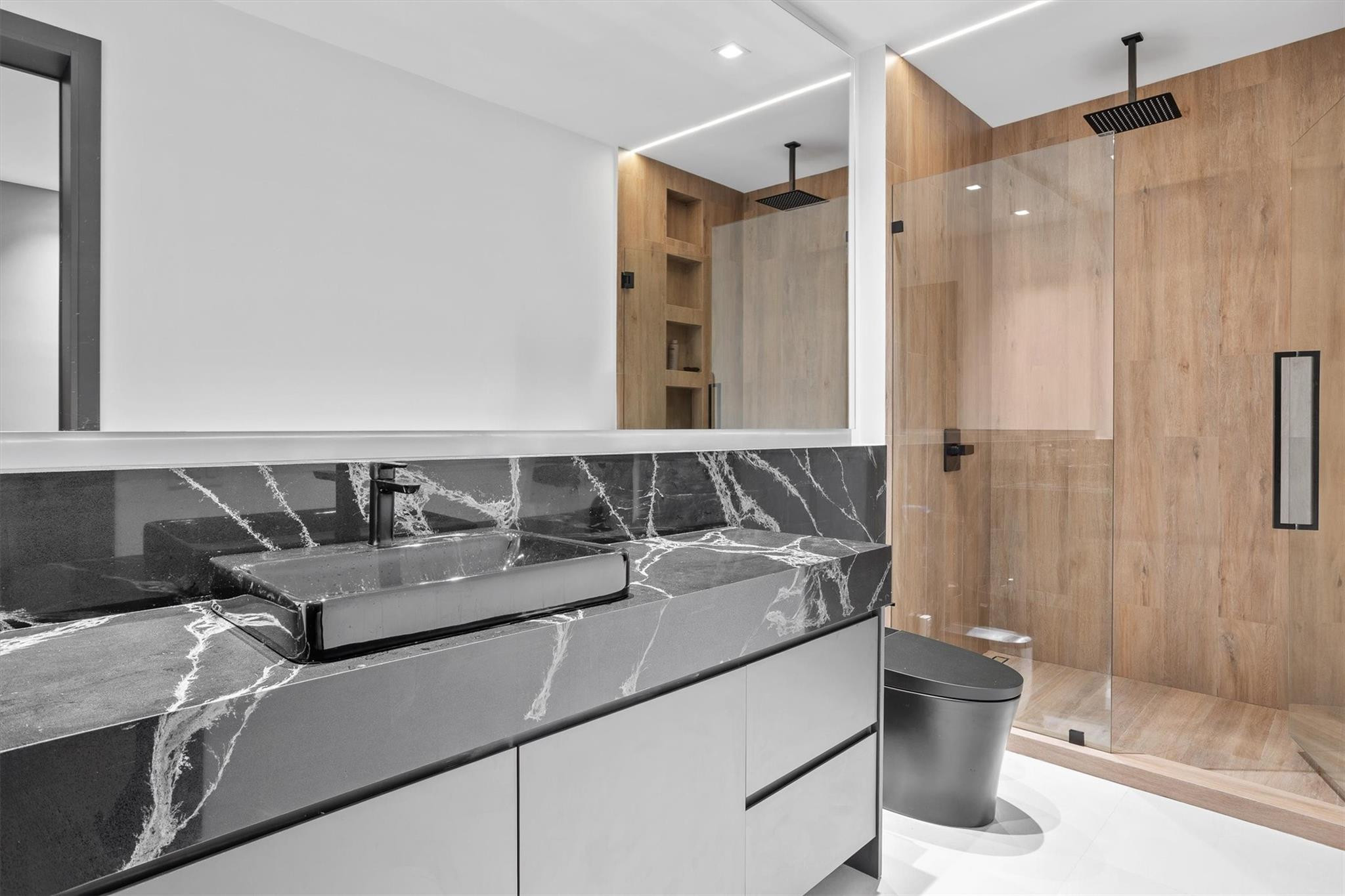 3340 Paddock Road Weston, FL 33331 - Photo 57 of 68 a bathroom with a granite countertop sink a toilet and shower