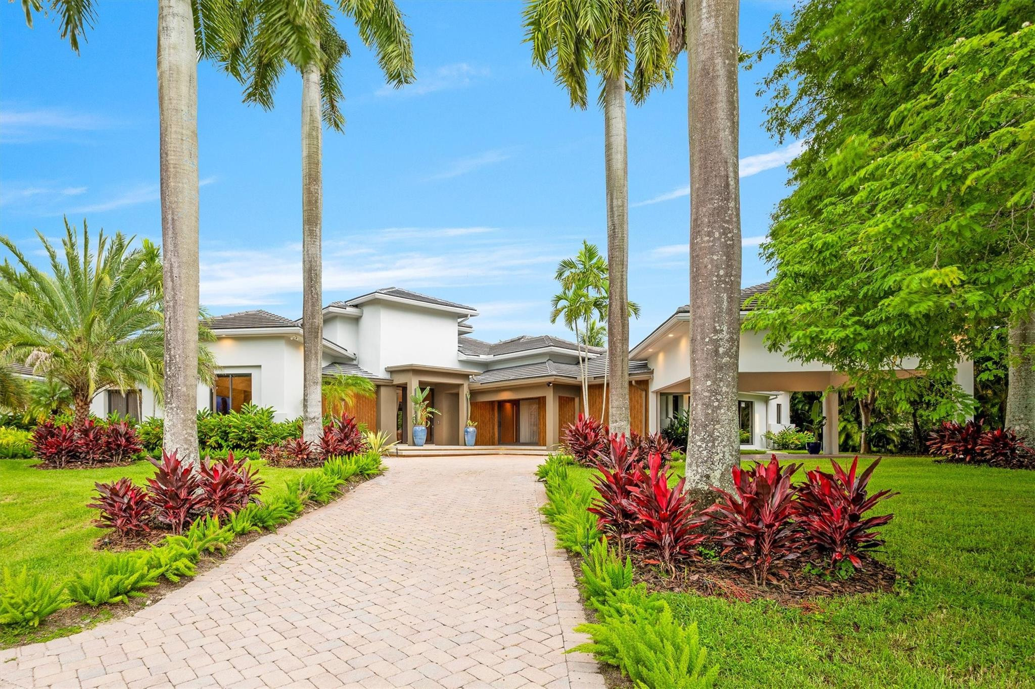 3340 Paddock Road Weston, FL 33331 - Photo 64 of 68 a front view of a house with garden
