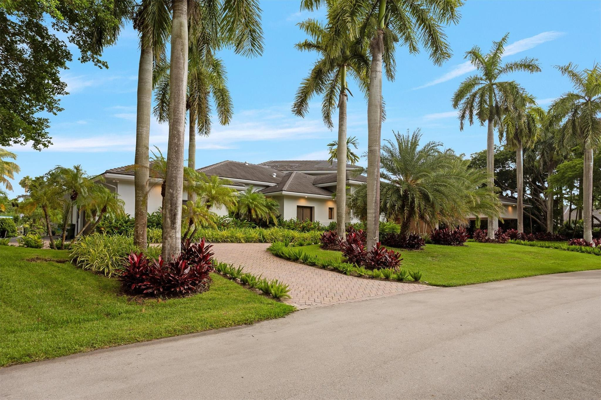 3340 Paddock Road Weston, FL 33331 - Photo 68 of 68 a front view of multi story residential apartment building with yard and green space