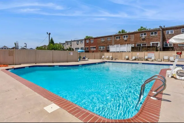 a view of a swimming pool with a lounge chairs
