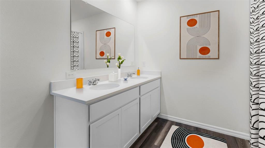 2834 House Finch Road St. Cloud, FL 34773 - Photo 10 of 48 a bathroom with a sink and a mirror