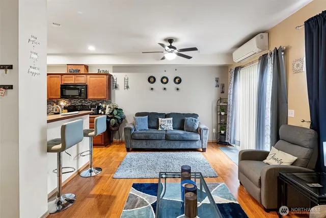 a living room with furniture fireplace and flat screen tv