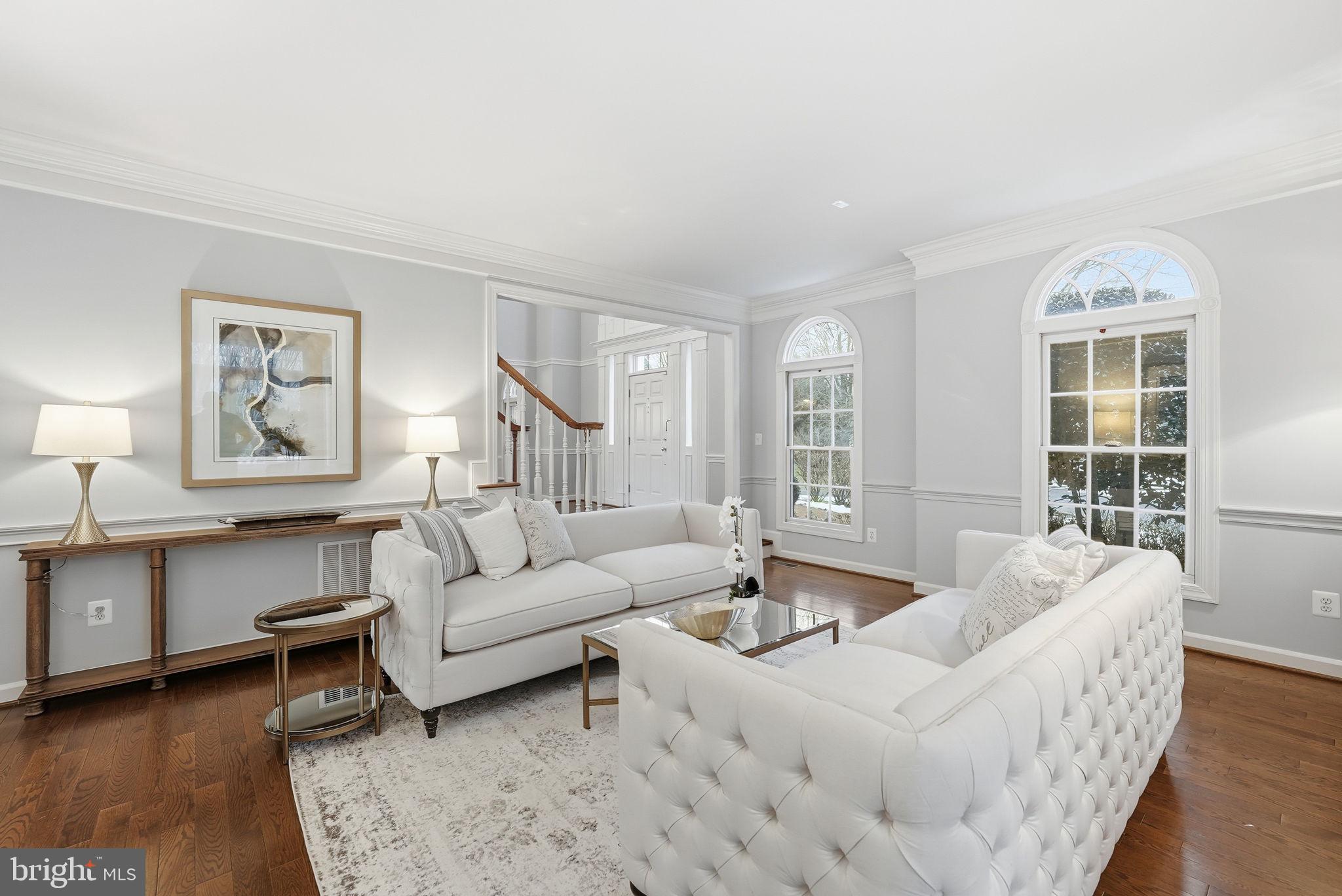 11588 Cedar Chase Road Herndon, VA 20170 - Photo 11 of 81 a living room with furniture and a potted plant on table