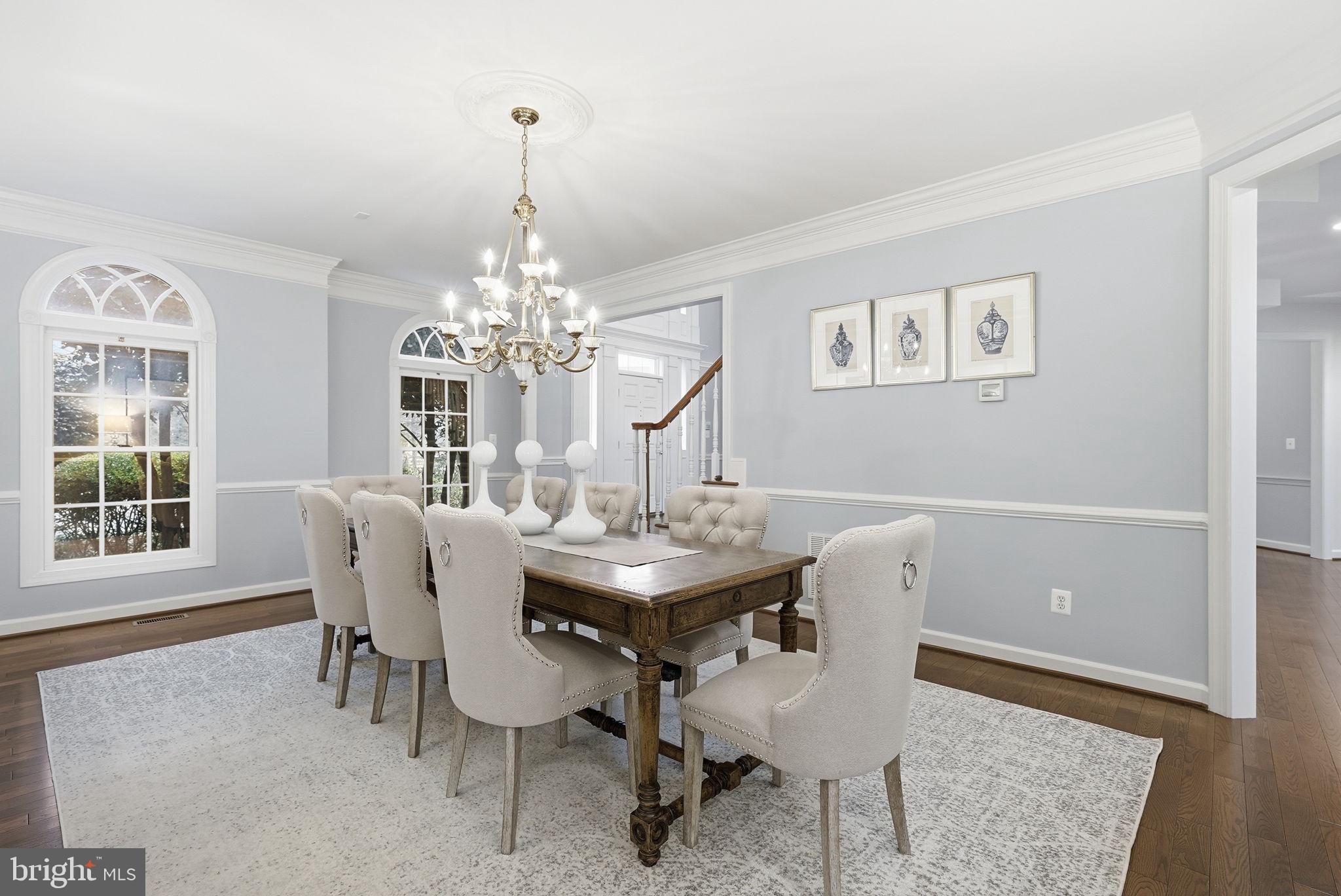 11588 Cedar Chase Road Herndon, VA 20170 - Photo 22 of 81 a dining room with furniture a chandelier and window