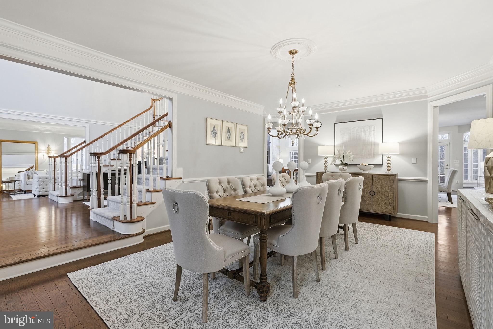 11588 Cedar Chase Road Herndon, VA 20170 - Photo 23 of 81 a dining room with furniture a chandelier and wooden floor