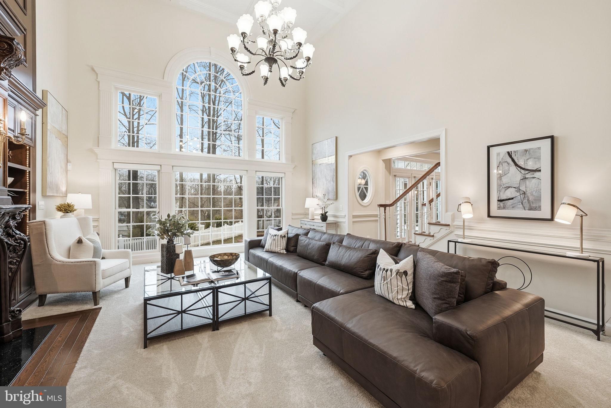 11588 Cedar Chase Road Herndon, VA 20170 - Photo 28 of 81 a living room with furniture and a chandelier