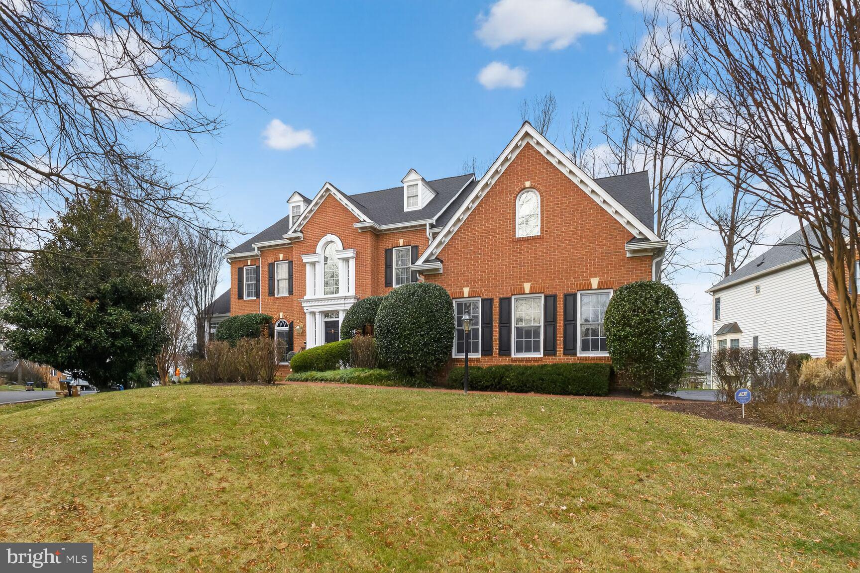 11588 Cedar Chase Road Herndon, VA 20170 - Photo 3 of 81 a front view of a house with a yard