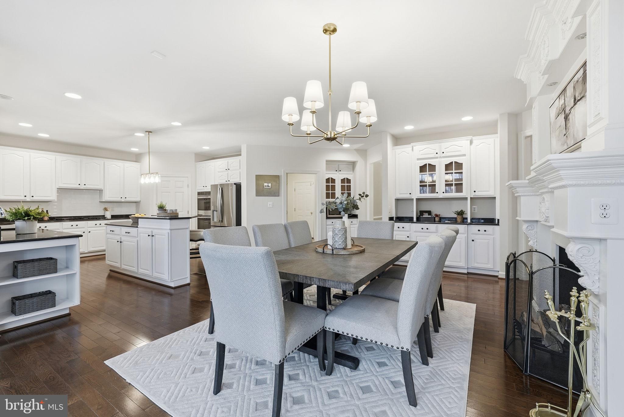 11588 Cedar Chase Road Herndon, VA 20170 - Photo 33 of 81 a view of a dining room with furniture and wooden floor