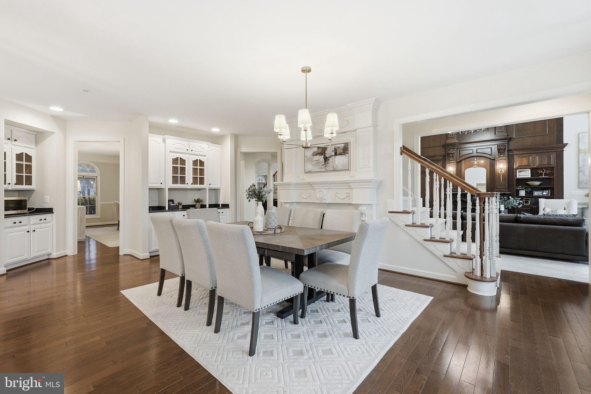 11588 Cedar Chase Road Herndon, VA 20170 - Photo 34 of 81 a dining room with furniture a chandelier and wooden floor