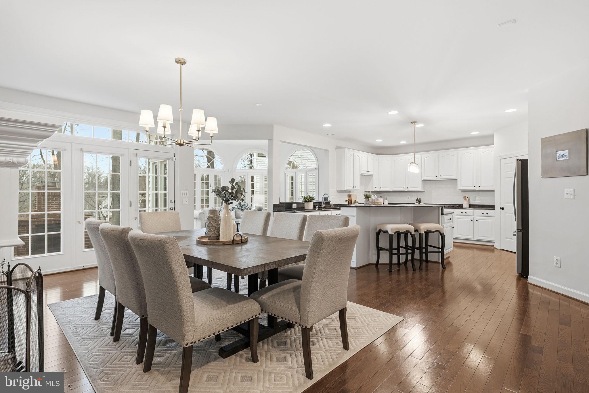11588 Cedar Chase Road Herndon, VA 20170 - Photo 36 of 81 a view of a dining room with furniture window and wooden floor