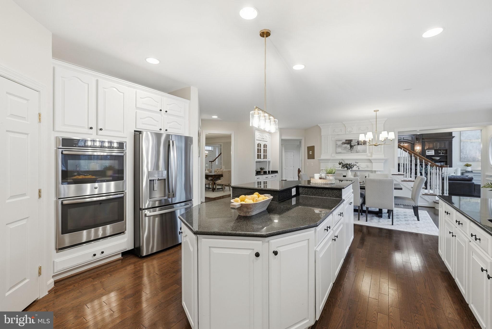 11588 Cedar Chase Road Herndon, VA 20170 - Photo 40 of 81 a kitchen with stainless steel appliances granite countertop a sink a stove and a refrigerator