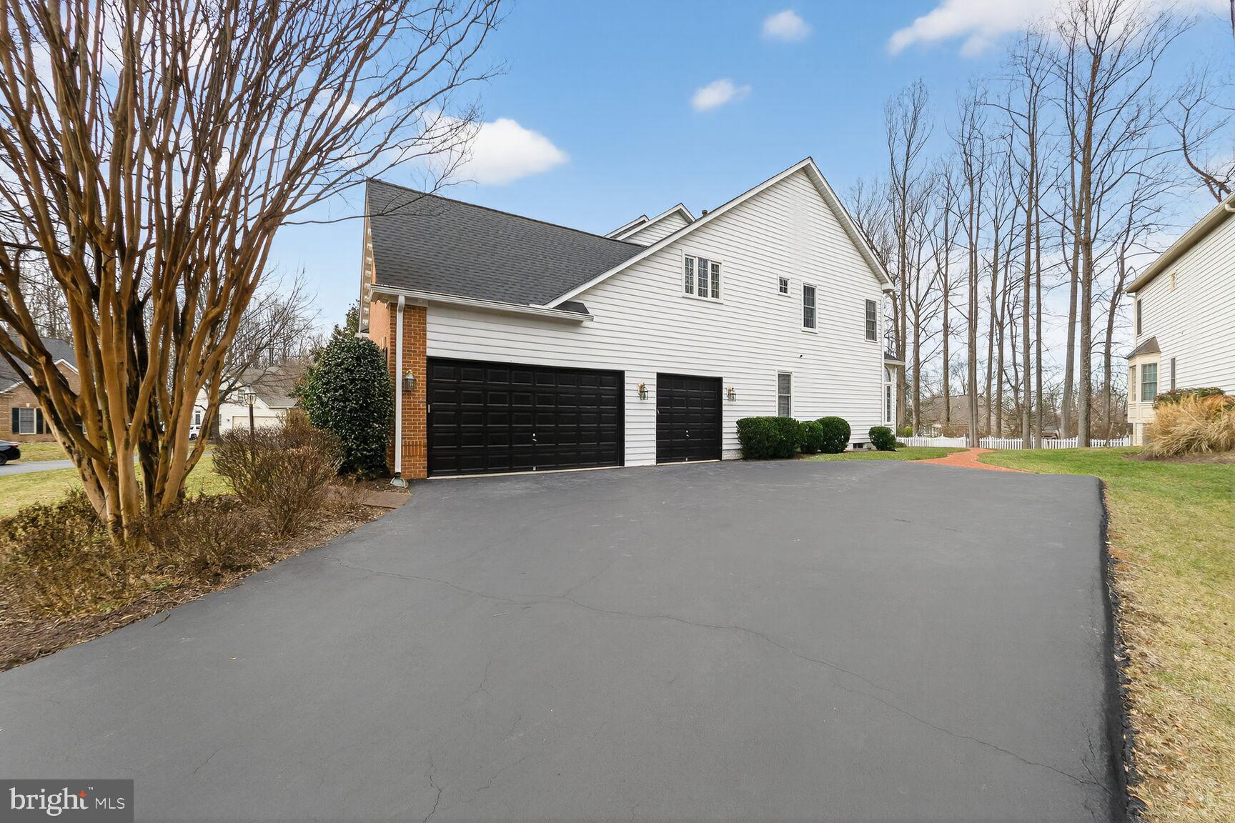 11588 Cedar Chase Road Herndon, VA 20170 - Photo 4 of 81 a view of a house with a yard and garage