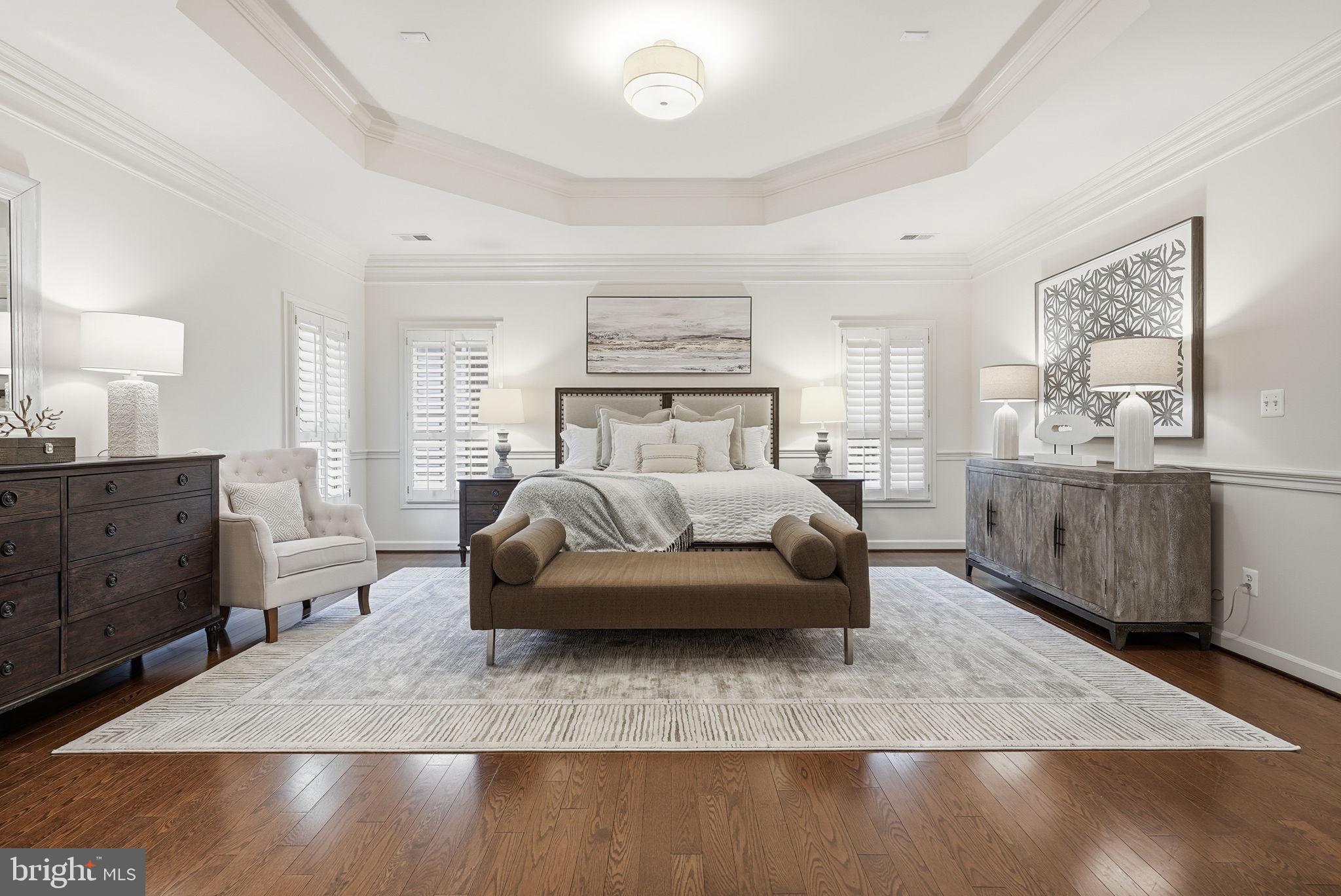 11588 Cedar Chase Road Herndon, VA 20170 - Photo 52 of 81 a bedroom with a large bed and wooden floor