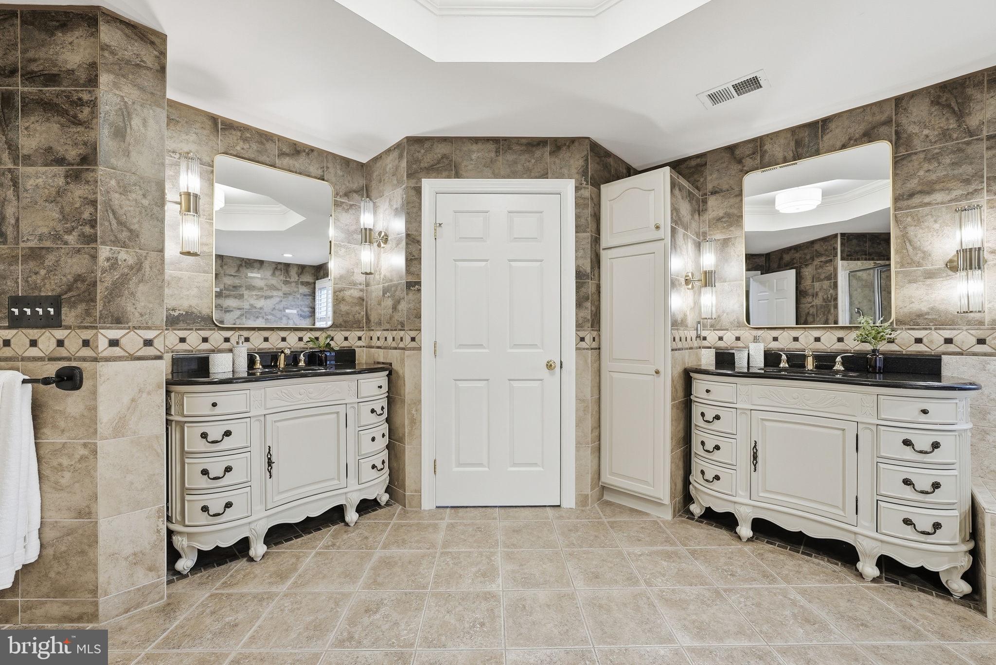 11588 Cedar Chase Road Herndon, VA 20170 - Photo 56 of 81 a spacious bathroom with a granite countertop sink mirror and